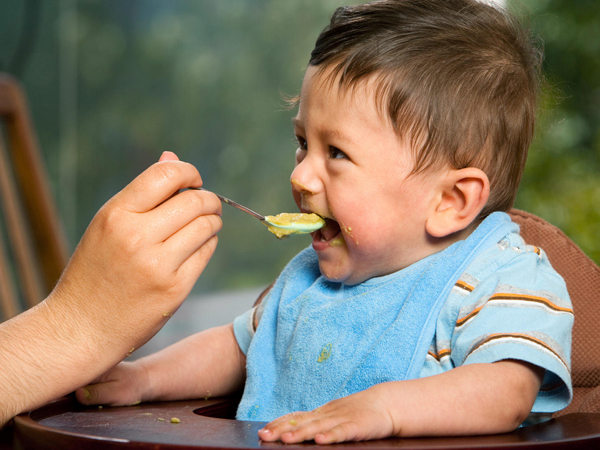 What time of the day should the baby eat solids when he turns 6 months?